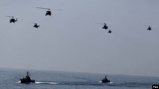Iranian helicopters and war-boats during 'Velayat-90' navy exercises in the Strait of Hormuz (file photo)