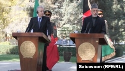 Italian Prime Minister Mario Monti (left) appears at a Kabul press conference on November 4 with Afghan President Hamid Karzai.
