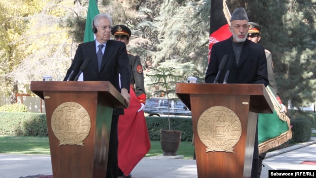 Italian Prime Minister Mario Monti (left) appears at a Kabul press conference on November 4 with Afghan President Hamid Karzai.