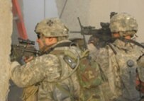 Soldiers engaging snipers in Al-Sadr City (RFE/RL)