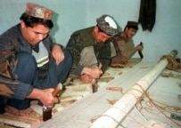 Ethnic Turkmen from Afghanistan weaving a carpet in Pakistan (file photo) (epa)