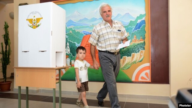 Nagorno-Karabakh - A many votes at a polling station in Stepanakert, 19Jul2012.