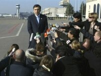 Georgian President Mikheil Saakashvili at Tbilisi airport today (AFP)
