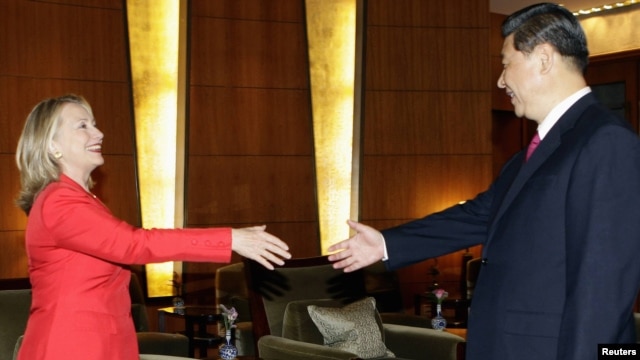 A photo of Chinese Vice President Xi Jinping meeting with U.S. Secretary of State Hillary Clinton in Beijing in May. Xi's sudden cancellation of more recent meetings set the rumor mill spinning.