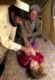 A doctor attends to a sick child who is among the displaced persons in the Afghan border town of Spin Boldak
