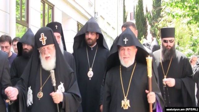 Catholicos Garegin II (left) and Catholicos Patriarch Ilia II meet in Tbilisi on June 11.