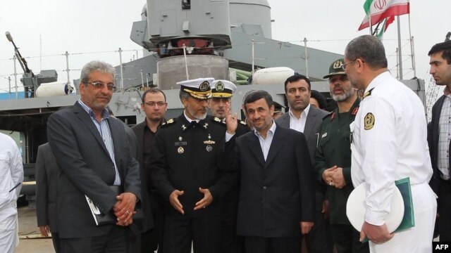 Iranian President Mahmud Ahmadinejad (center) attended the inauguration of the "Jamaran-2" guided-missile destroyer in the port city of Anzali on March 17.