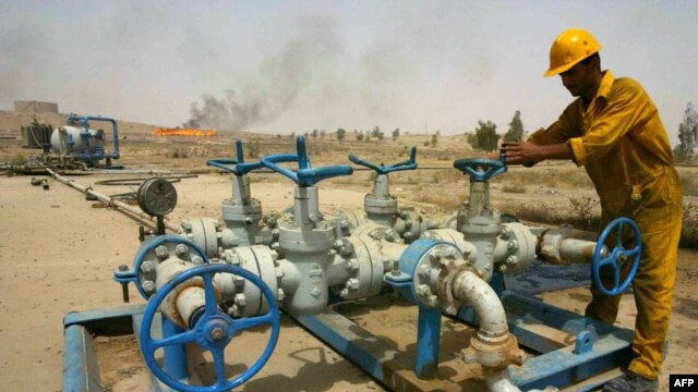 A worker checks the valves at the Kirkuk oil field.
