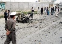 Afghan police officers on the site of a March 30 suicide attack on a Canadian military convoy in Kandahar (file photo) (epa)