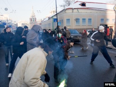 Youths attack participants in an opposition-sponsored march in Moscow.