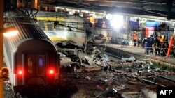 Rescuers work through the night at the site of a deadly train crash near Paris on July 12.