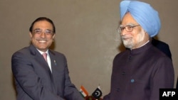 Pakistani President Asif Ali Zardari (left) and Indian Prime Minister Manmohan Singh shake hands on the sidelines of a summit in Yekaterinburg, Russia, in 2009.