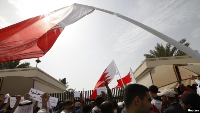 Protesters block the entrances to the upper house of Bahrain's National Assembly in Manama on February 28.