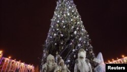 Father Frosts and Snow Maidens stand near a decorated tree in the Kyrgyz capital. (file photo)