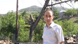 Armenia - RFE/RL correspondent Hovannes Shoghikian reports from Chinari against the backdrop of an Azerbaijani army post overlooking the Armenian border village, 8Jun2012.