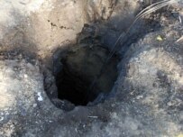A crater at the site where Georgia says the missile landed (InterPressNews)