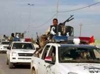 Iraqi security forces moving toward the Al-Najaf fighting on January 28 (epa)