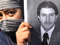 A journalist protests for Kambakhsh's release (AFP)