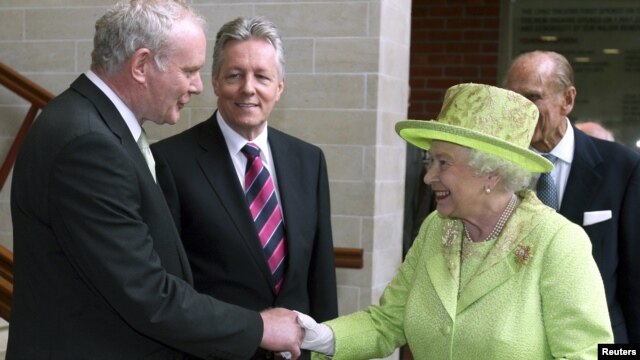 Queen Elizabeth greets Northern Ireland's deputy first minister, Martin McGuinness, in Belfast on June 27.