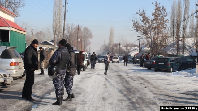 Kyrgyz authorities at the scene after the violence broke out between local residents in Uzgen and workers from China on January 9.