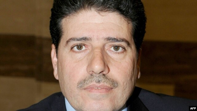  Wael al-Halqi, the former health minister, was appointed  Syria's new prime minister.
