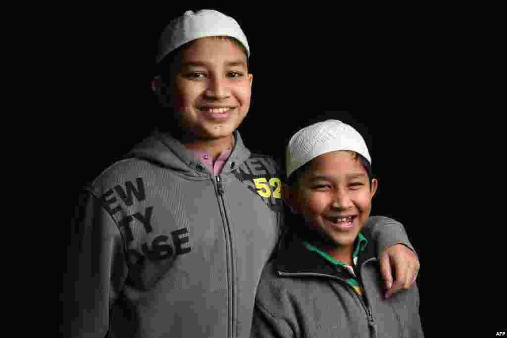 Seventh-grader Mohammed Tamim, 12, and his brother Mohammed Talha, 6, come from Bangladesh. Their father, Mohammed Firoz, is a naturalized American from Bangladesh who works in construction in Brooklyn, New York City.