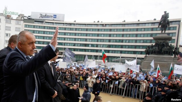 Bulgaria -- Outgoing Prime Minister Boyko Borisov waves to supporters outside the parliament in Sofia, 21Feb2013
