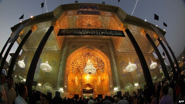 Shi'ite pilgrims gather at the shrine of Imam Musa al-Kadhim in northern Baghdad's Kadhimiyah neighborhood, as they commemorate the death anniversary of the revered Shiite imam on June 14.