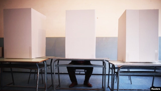 A man casts his vote at a polling booth in Potocari, near Srebrenica.