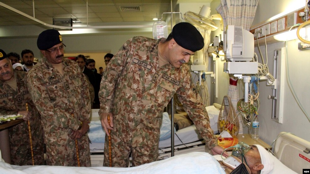 A Pakistani Army general visits a victim of cross-border Indian firing at the line of control in the disputed Himalayan region of Kashmir.