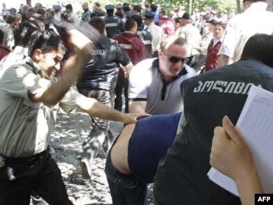 Georgian police battle opposition protesters in Tbilisi.
