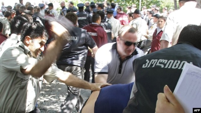 Georgian police battle opposition protesters in Tbilisi.