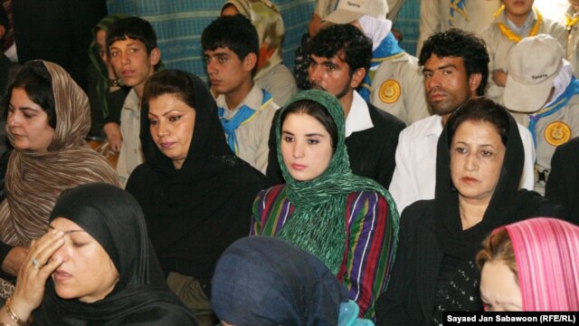 Afghan women listen to a speech by Afghan President Hamid Karzai during an event marking International Literacy Day in Kabul on September 28, 2010.