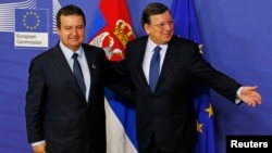 Serbian Prime Minister Ivica Dacic (left) was welcomed by European Commission President Jose Manuel Barroso ahead of a meeting at EC headquarters in Brussels on January 21.