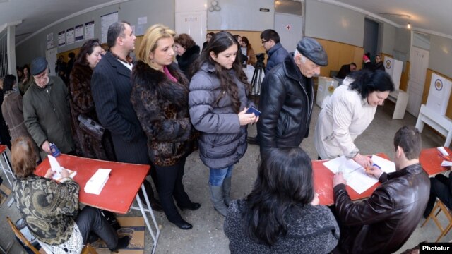 Armenia - Residents of Yerevan queue up at a polling station to vote in a presidential election, 18Feb2013.