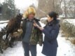 A Kazakh Service correspondent interviews a falconer and his falcon.