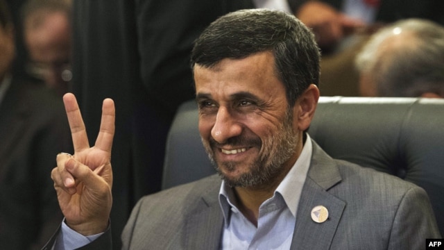 Iranian President Mahmud Ahmadinejad flashes the victory sign as he attends the 12th summit of the Organization of Islamic Cooperation in Cairo on February 6.