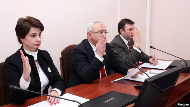 Armenia - Central Election Commission (CEC) Chairman Tigran Mukuchian (C) and other members of the CEC approve the final results of the February 18 presidential election, Yerevan, 25Feb2013.