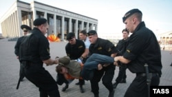 Police break up the demonstration protesting Russian troops' presence.