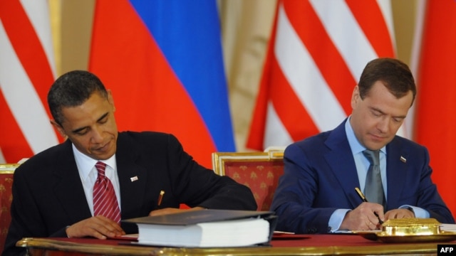 U.S. President Barack Obama (left) and his Russian counterpart Dmitry Medvedev sign the initial treaty in Prague in April.
