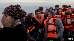 Refugees and migrants arrive by dinghy from Turkey on the Greek island of Lesbos in February. Despite Ankara's crackdown on such transports, people smugglers are confident that it won't have too much of an adverse impact on their trade.