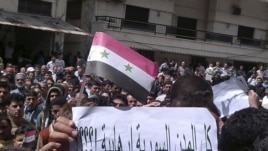 Protesters during a demonstration after Friday Prayers in the port city of Banias on May 6