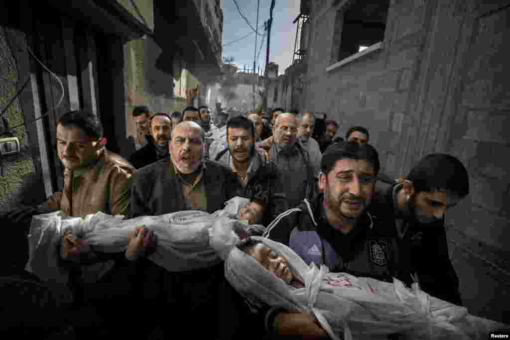 Paul Hansen of Sweden, a photographer working for the Swedish daily "Dagens Nyheter," won the World Press Photo of the Year 2012 with this picture of a group of men carrying the bodies of two dead children through a street in Gaza City. "The strength of the picture lies in the way it contrasts the anger and sorrow of the adults with the innocence of the children. It's a picture I will not forget," jury member Mayu Mohanna said.