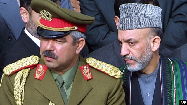 Hamid Karzai (right) with then Deputy Defense Minister General Abdul Rashid Dostum in March 2002.