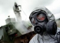 A British soldier wearing a nuclear, biological, and chemical (NBC) warfare suit