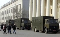Police trucks in central Minsk ahead of a rally to mark the anniversary of the Chornobyl disaster (RFE/RL)