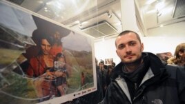 Poturovic stands by his prize-winning shot at the New Temple gallery in Sarajevo.