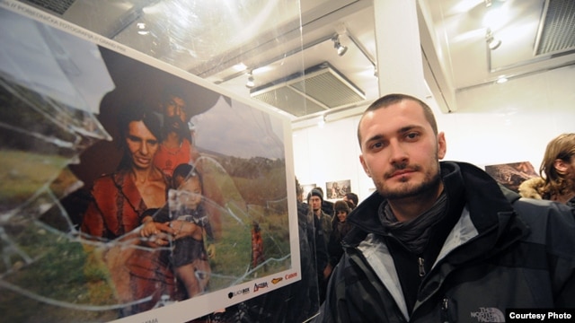 Poturovic stands by his prize-winning shot at the New Temple gallery in Sarajevo.