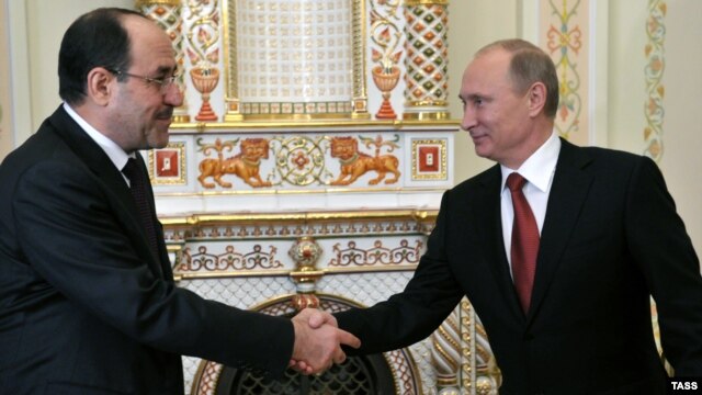 Russian President Vladimir Putin meets with Iraqi Prime Minister Nuri al-Maliki on October 10.