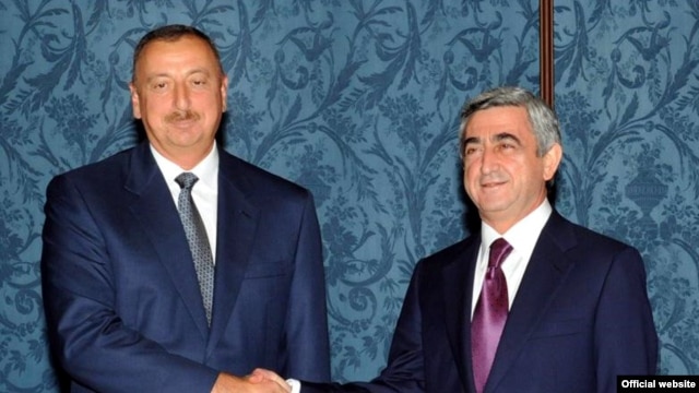 A previous meeting of the Armenian and Azerbaijani presidents -- Serzh Sarkisian (right) and Ilham Aliyev -- in Moscow in July